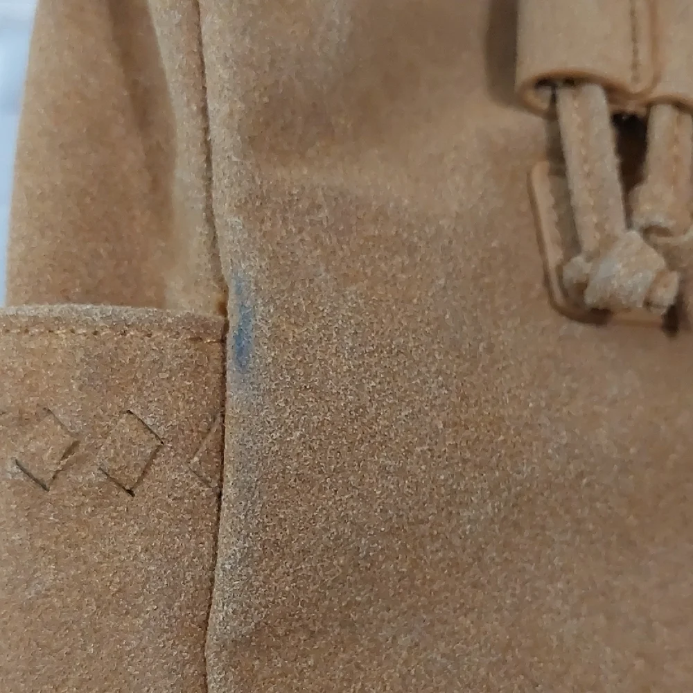 Elegant Tan Suede Backpack with Tassel Accents